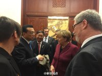 深圳翻译公司 中德总理上演“通道外交” 驻德大使客串翻译(图)